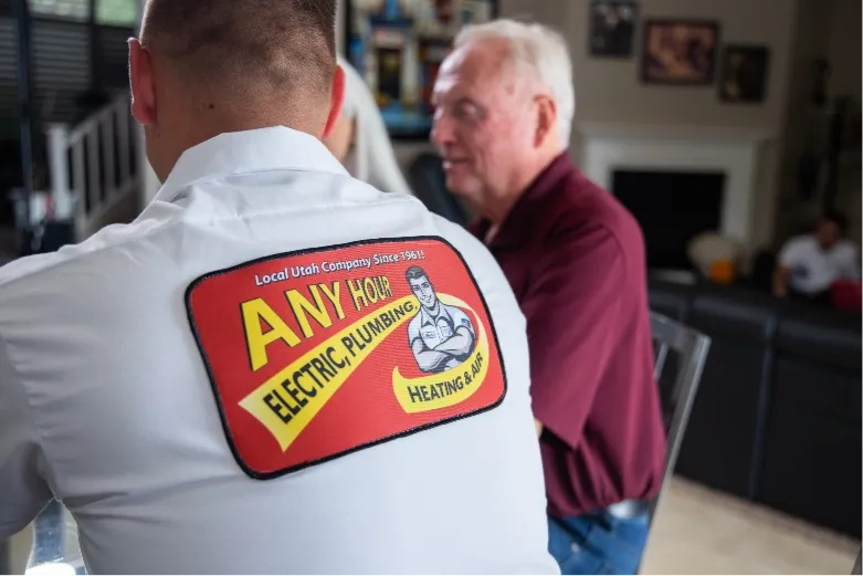 Any Hour technician talking to employee